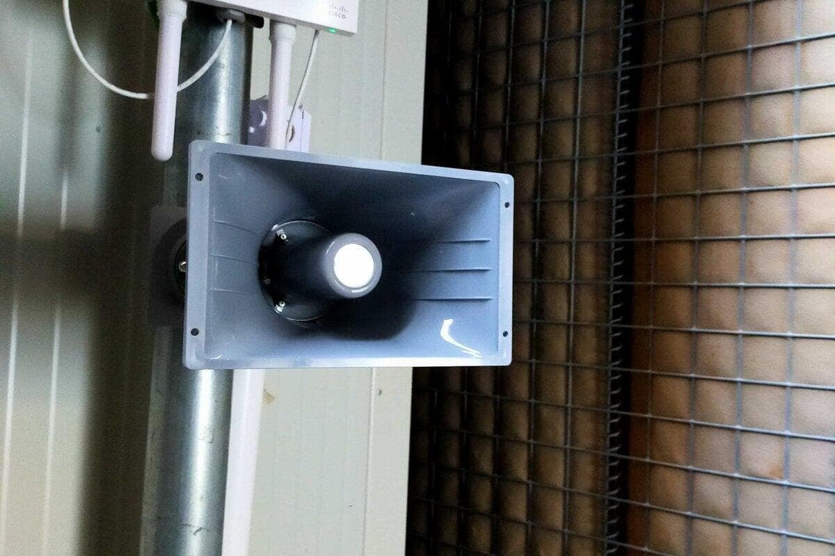 Mass notification transducer at a protected facility